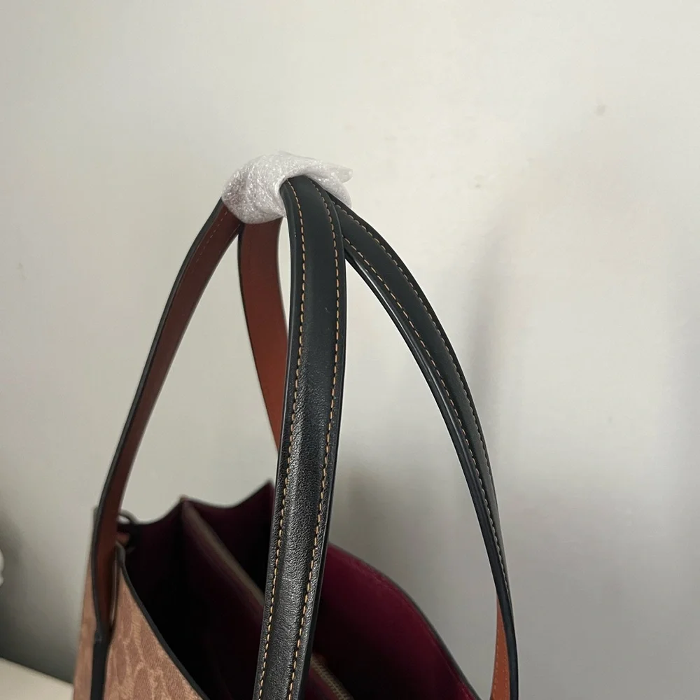 Disney X Coach Charlie Carryall
In Signature Canvas With Patches - Picture 7 of 15